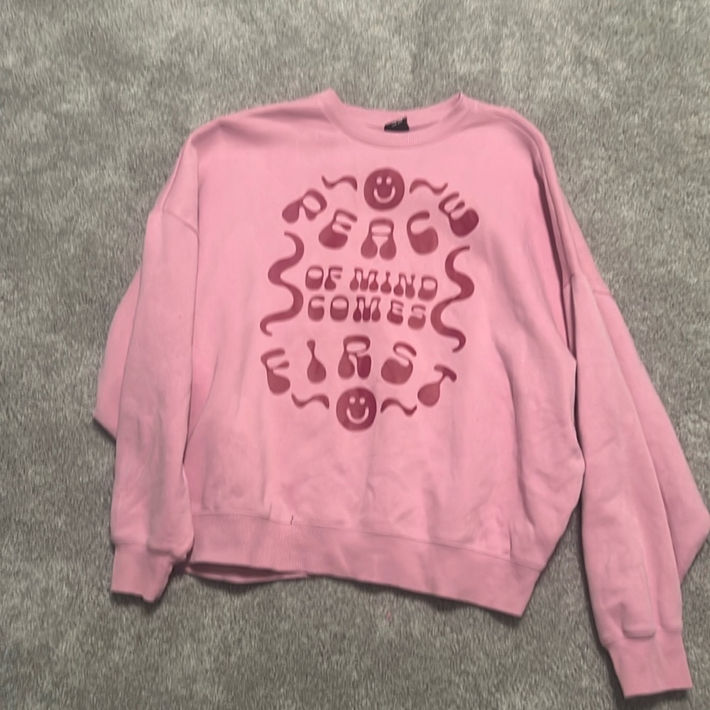Pink sweatshirt.